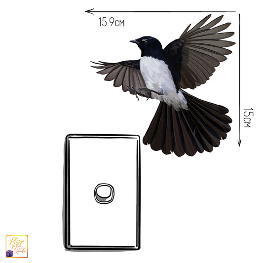 Small Willy Wagtail sticker fluttering above a light switch, showing a realistic "painted-on" look with no white borders.
