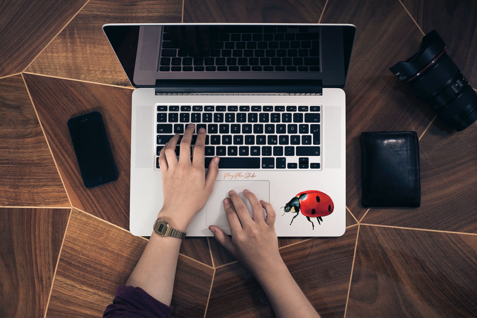 Small Lady Bug sticker positioned as if crawling on a laptop, featuring a seamless borderless edge.