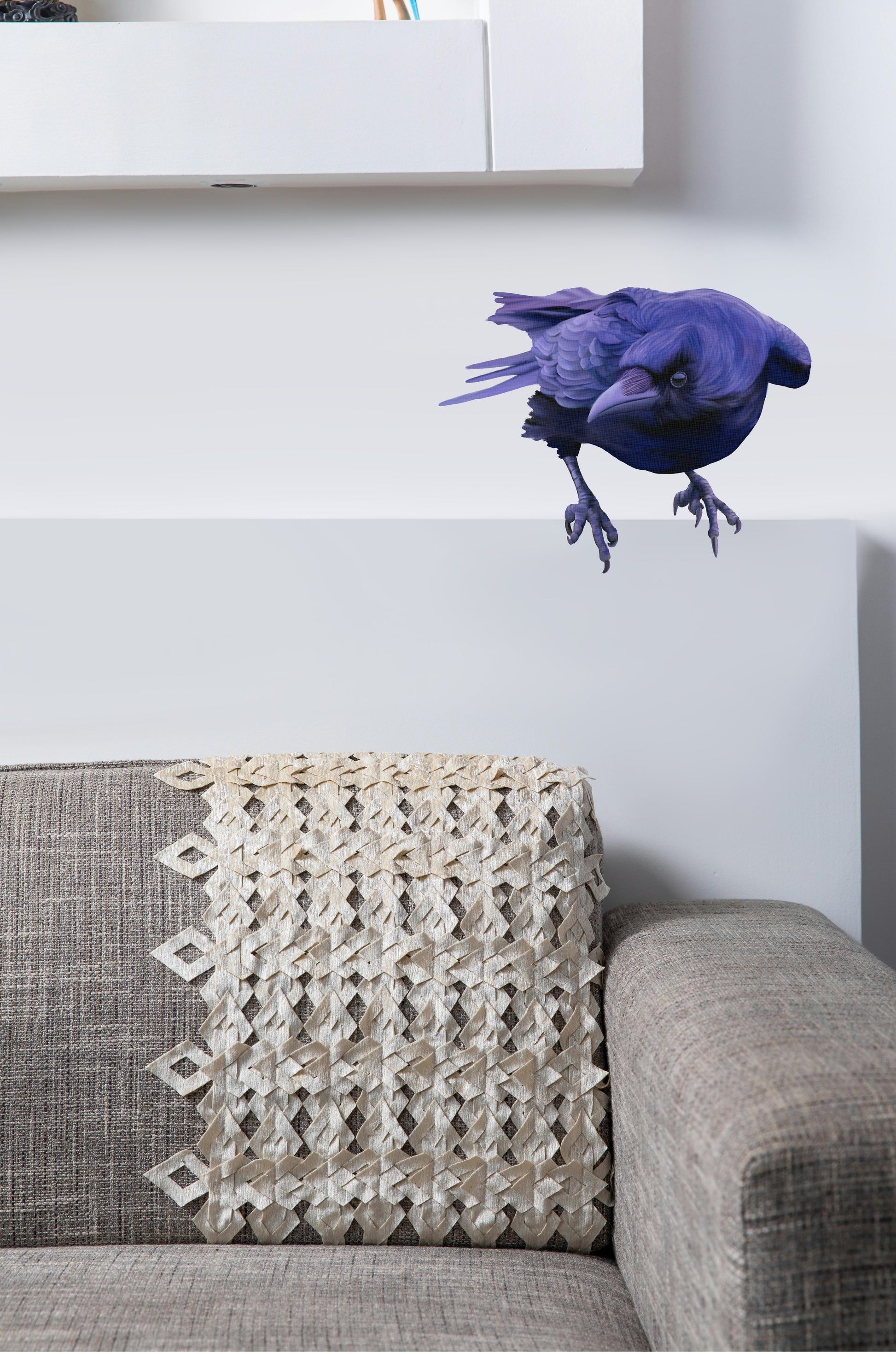 Life-sized black raven sticker perched above a lounge, creating a striking "Nevermore" gothic decor look.