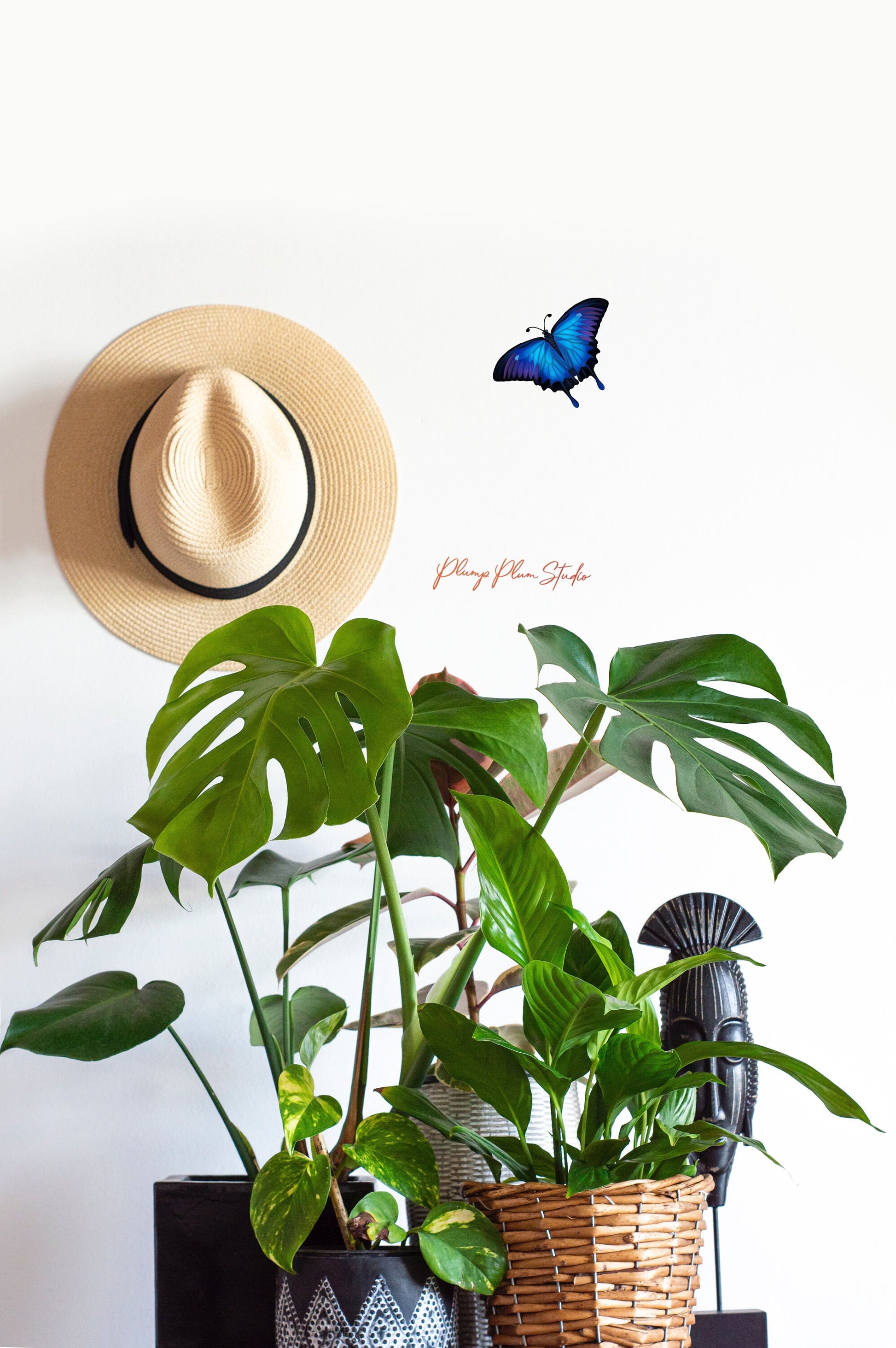 Vibrant blue butterfly wall sticker placed on a livingroom wall, featuring a realistic hand-painted look.