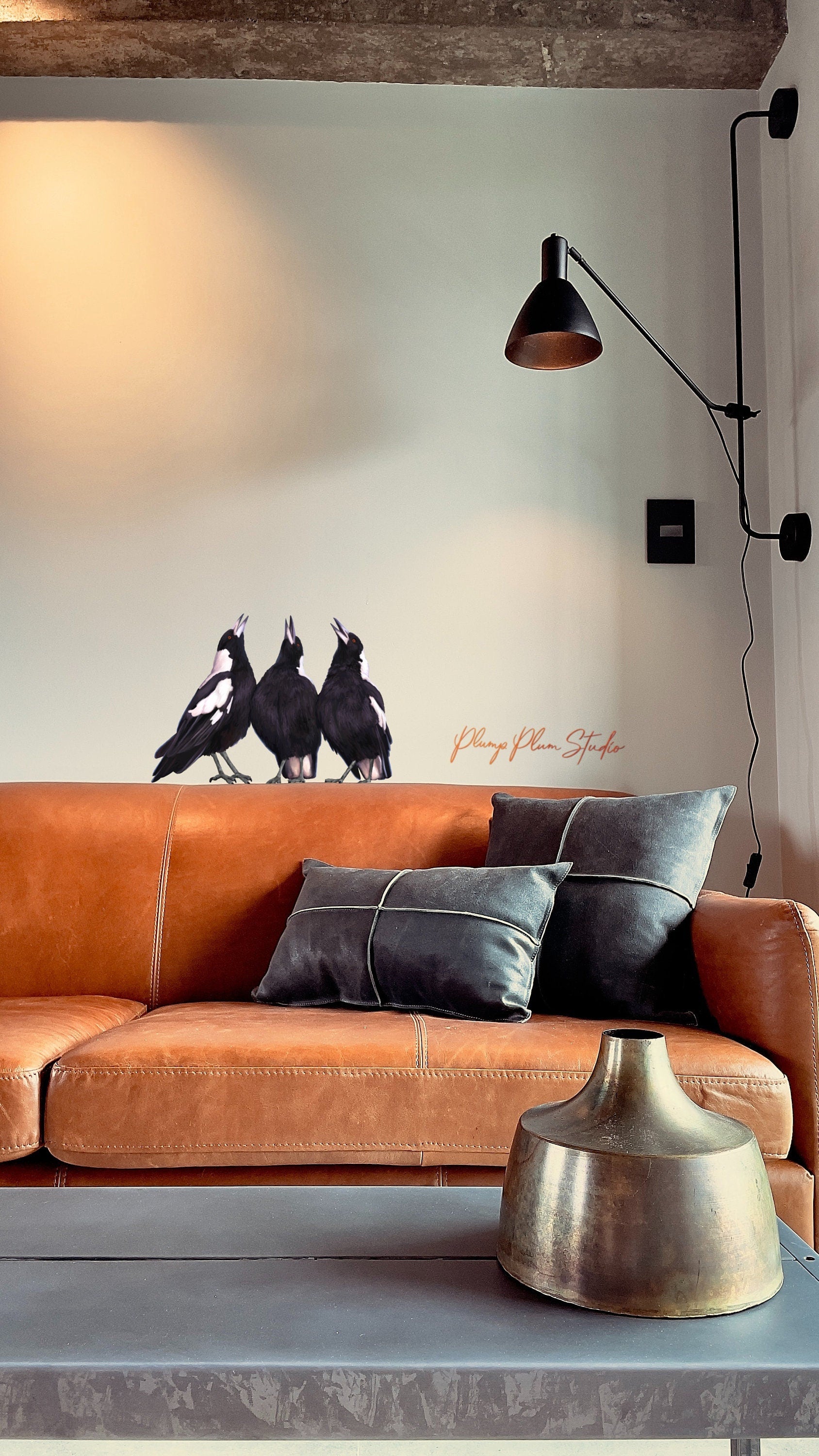 Waterproof Australian Magpie vinyl decal on a living room wall, featuring fade-resistant black and white hand-illustrated art.